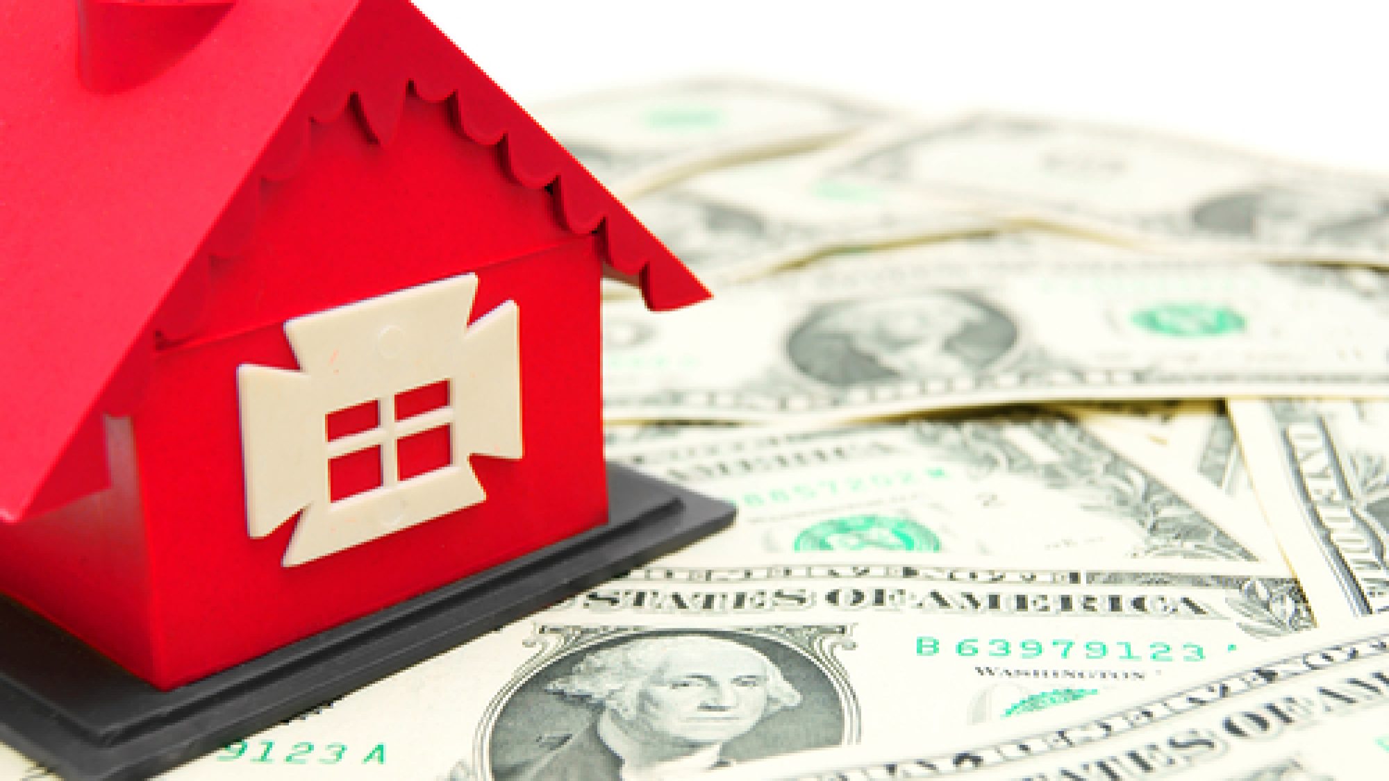 The,Toy,House,On,Money.,On,A,White,Background.