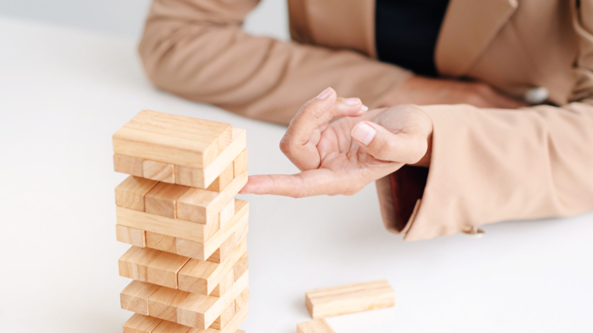 Business,Executive,Holding,Wooden,Block,,Risk,And,Strategy,In,Planing.