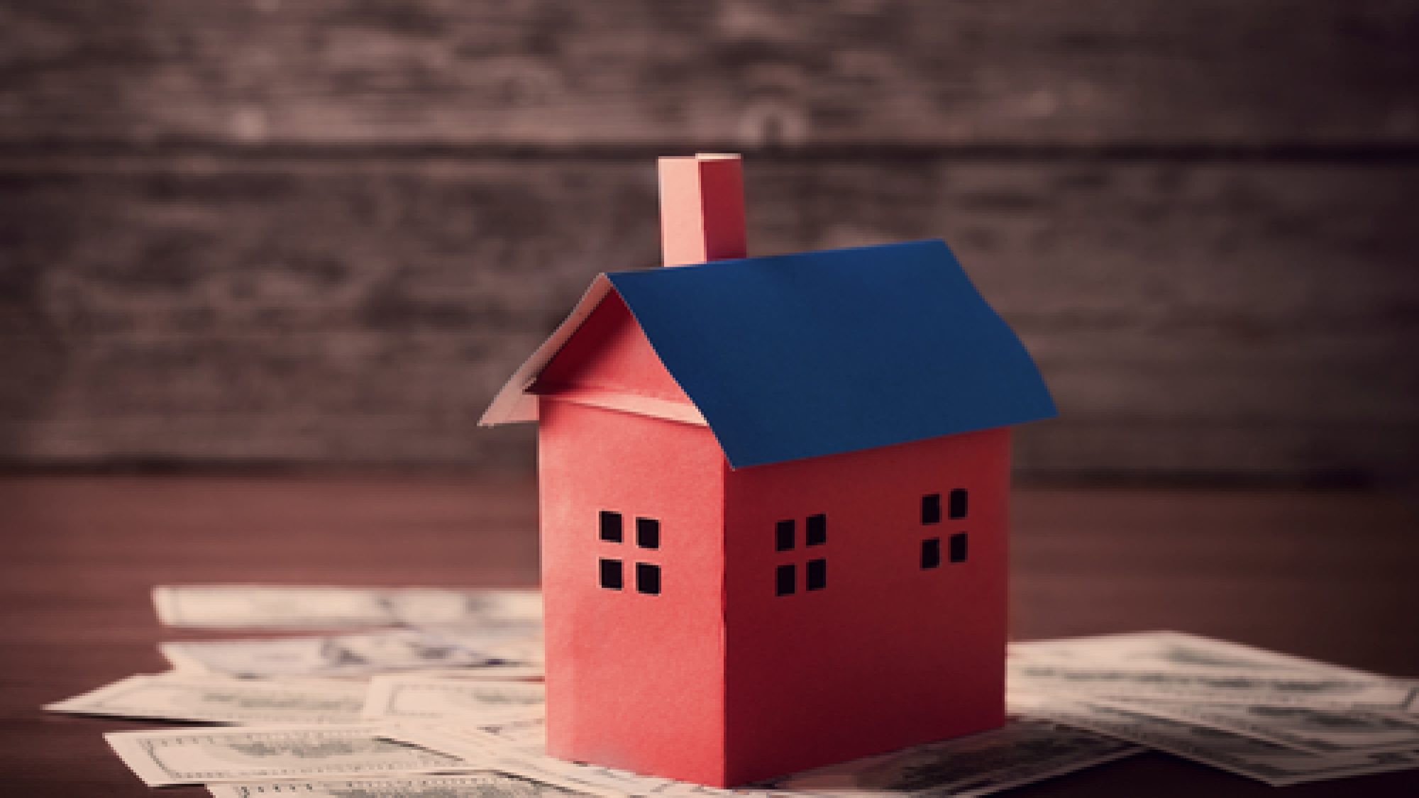 House,From,The,Paper,And,Money,On,Wooden,Background