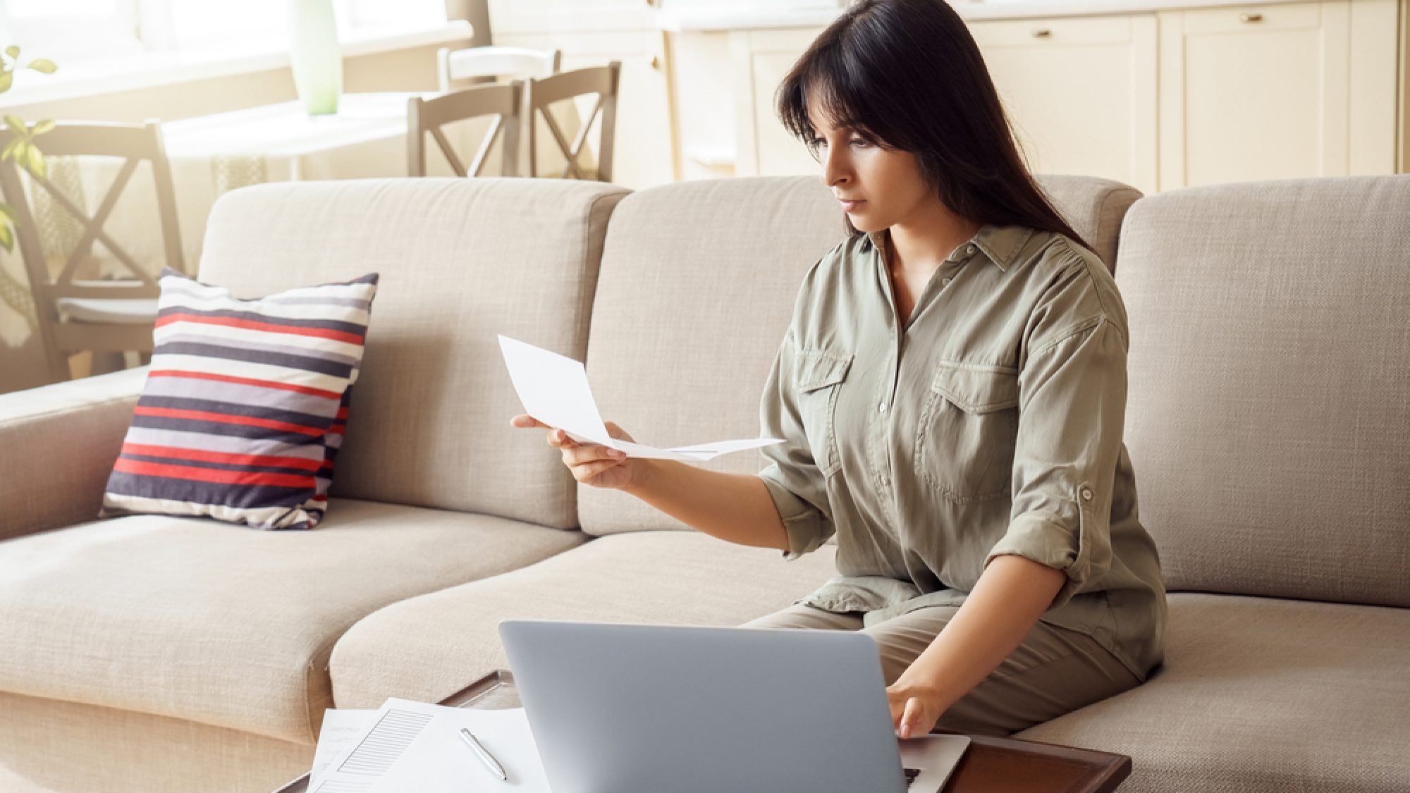 Young,Indian,Woman,Holding,Letter,Using,Laptop,Computer,Application,Paying