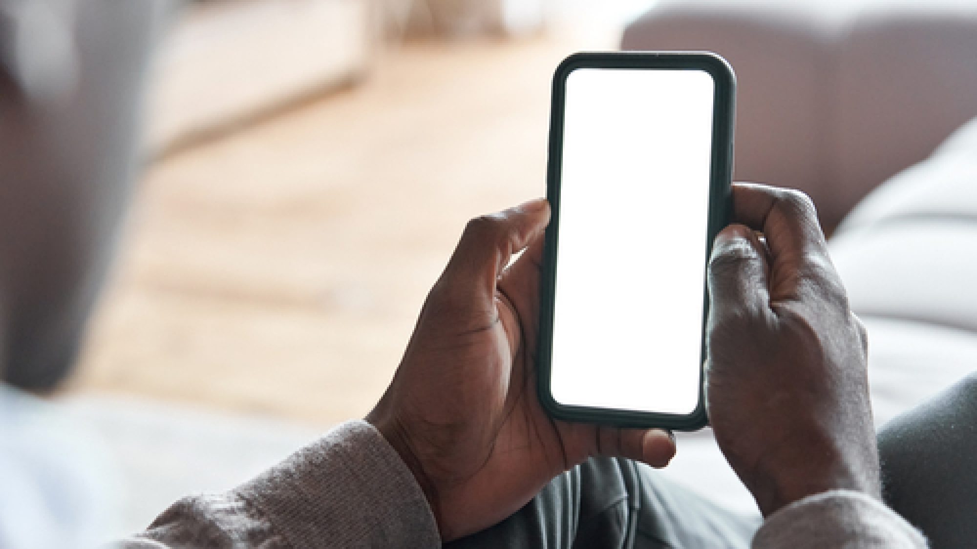 African,American,Man,Holding,Smart,Phone,With,Mockup,White,Blank