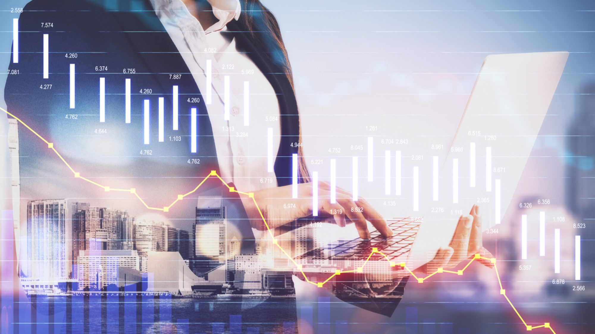 Businesswoman,With,Laptop,And,Economic,Crisis,Stock,Charts,On,City