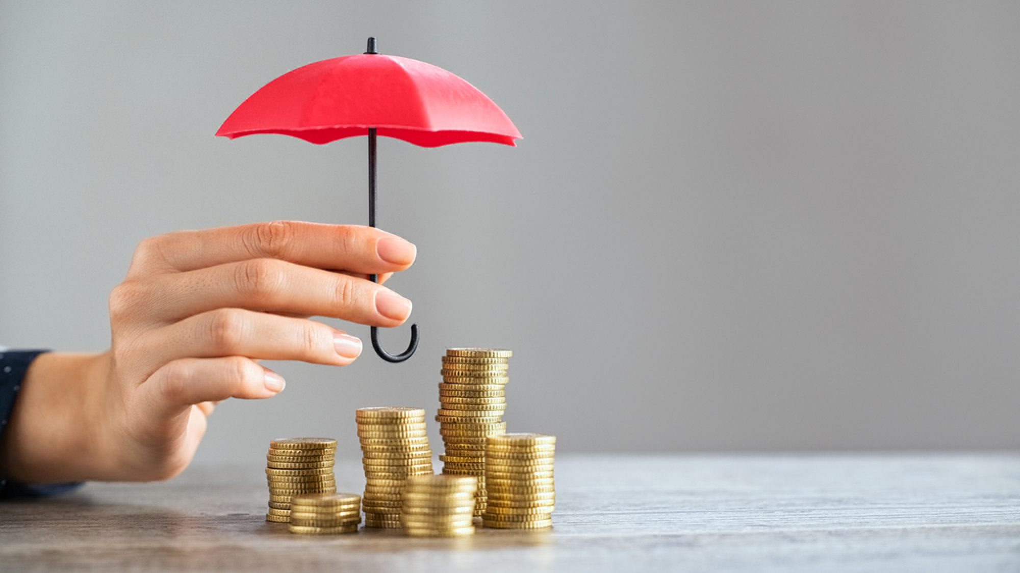 Young,Woman,Hand,Holding,Small,Red,Umbrella,Over,Pile,Of