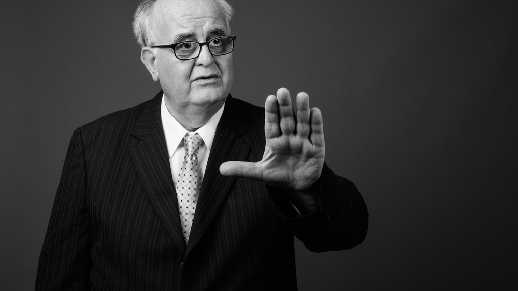 Overweight,Senior,Businessman,Wearing,Eyeglasses,Against,Brown,Background