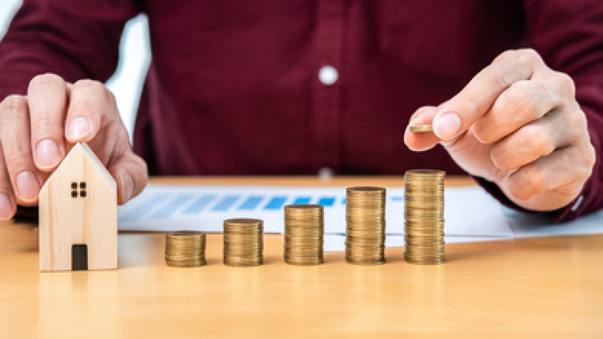 Asian,Business,Man,Holding,Coin,To,Putting,On,Coins,Stack