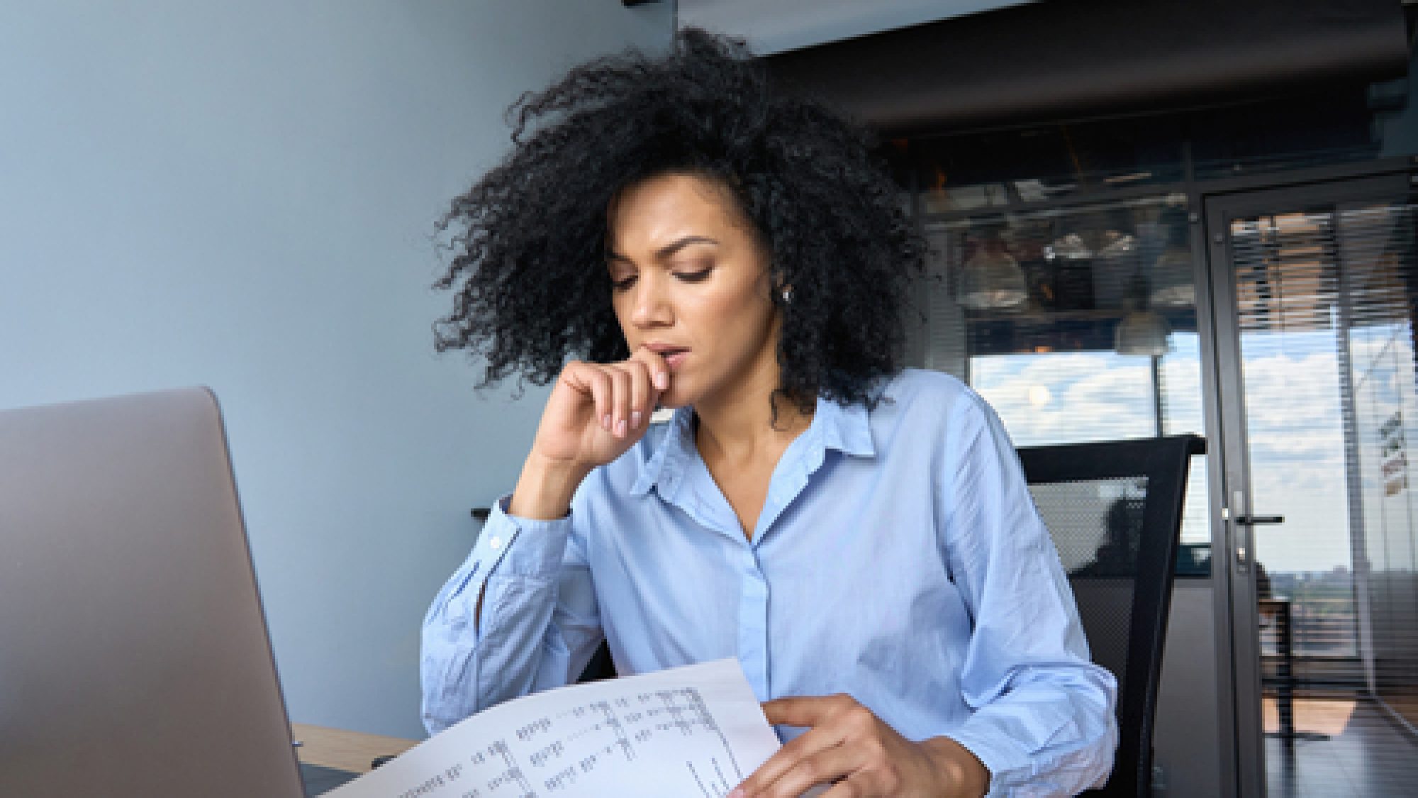 Concerned,African,American,Businesswoman,Ceo,Analyst,Sitting,At,Desk,Reading