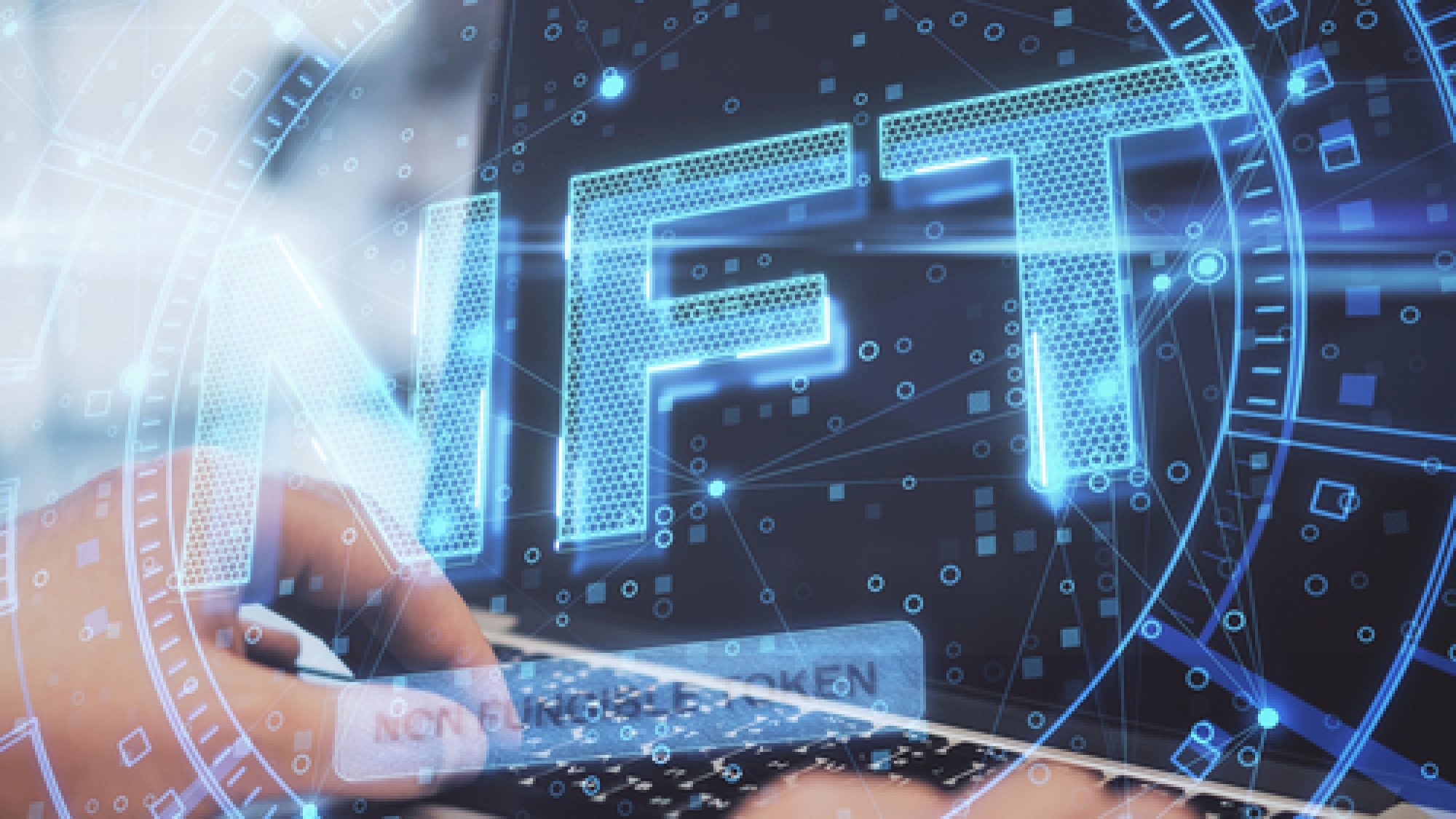 Close,Up,Of,Hands,Using,Laptop,Keyboard,With,Glowing,Nft