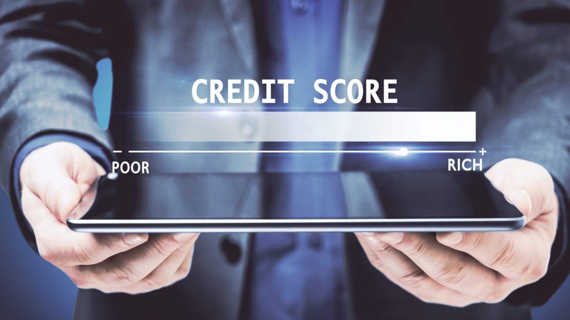 Businessman,Hands,Holding,Tablet,With,Glowing,Credit,Score,Hologram,On