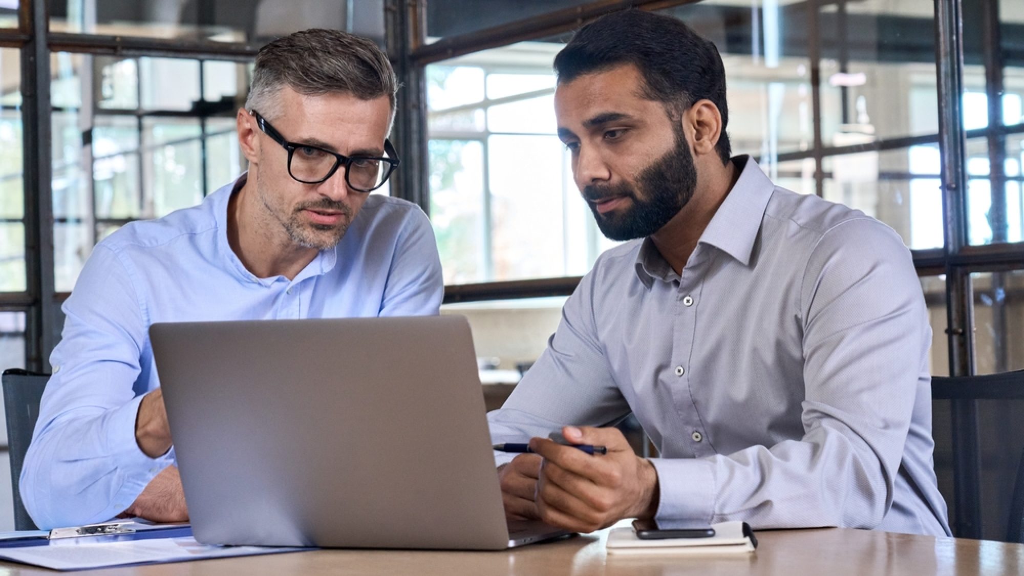 Two,Diverse,Business,Men,Analysts,Partners,Talking,,Working,Together,,Discussing