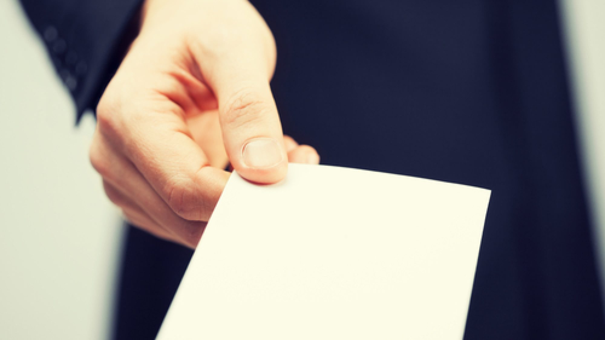 Picture,Of,Man,In,Suit,Holding,Credit,Card