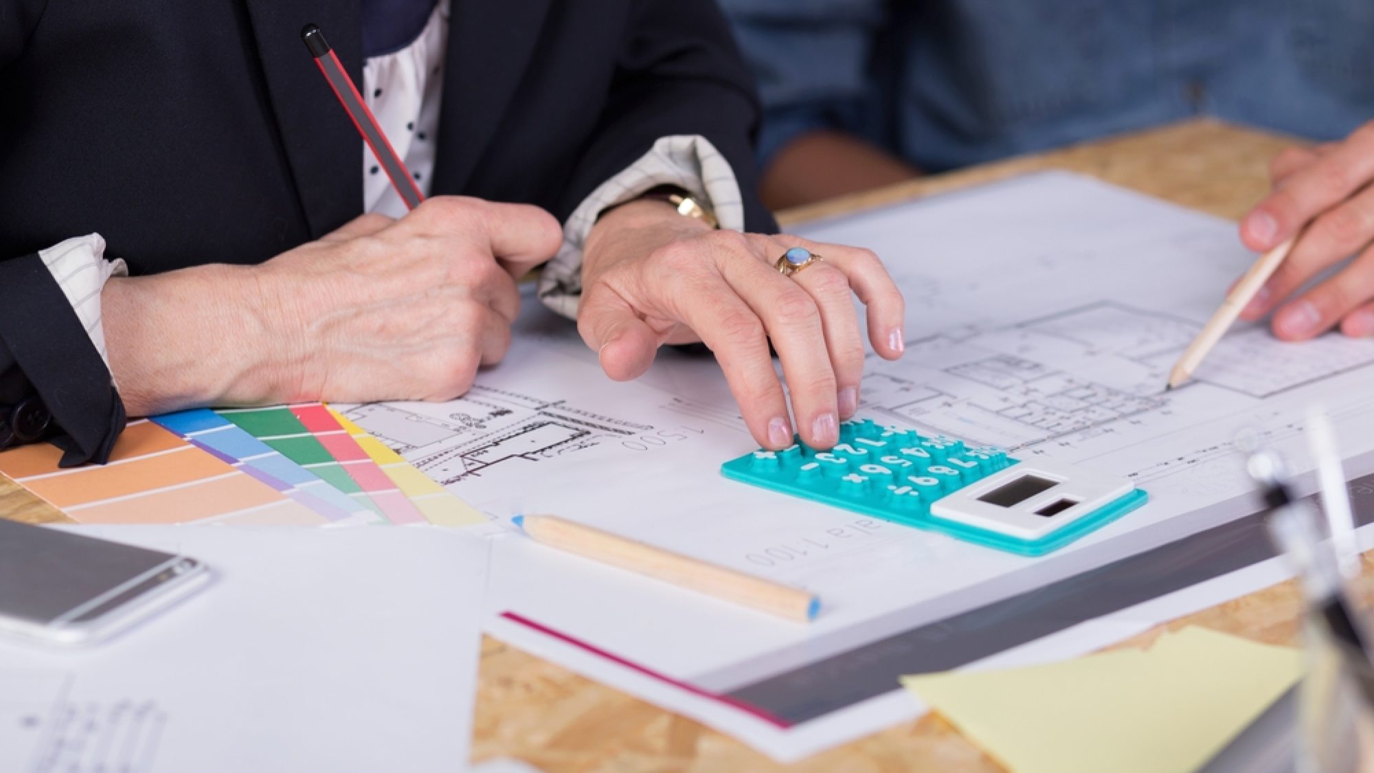 Close-up,Of,Interior,Designers,Estimating,Project,Cost