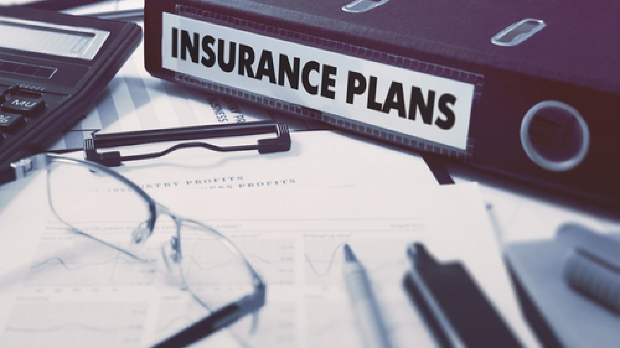 Insurance,Plans,-,Ring,Binder,On,Office,Desktop,With,Office