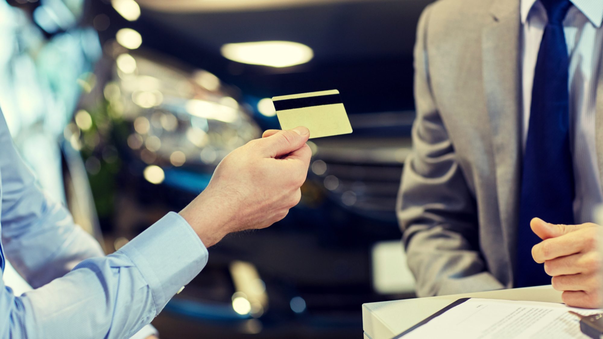 Customer,Giving,Credit,Card,To,Car,Dealer,In,Salon