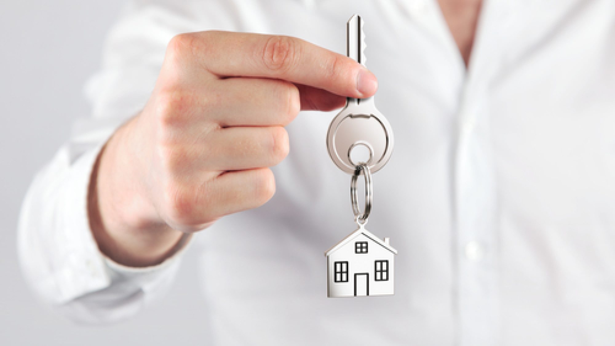 Giving,House,Key,With,A,Keychain,House,Form