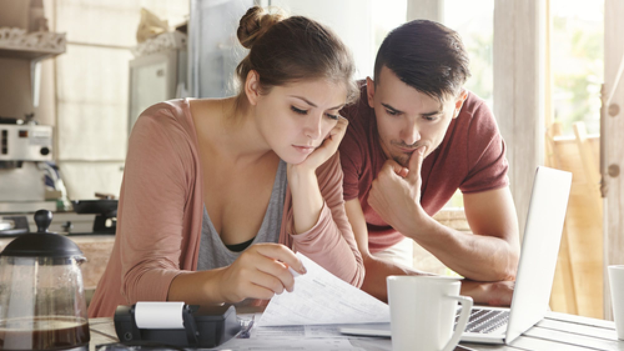 Worried,Young,Caucasian,Married,Couple,Reading,Important,Notification,From,Bank