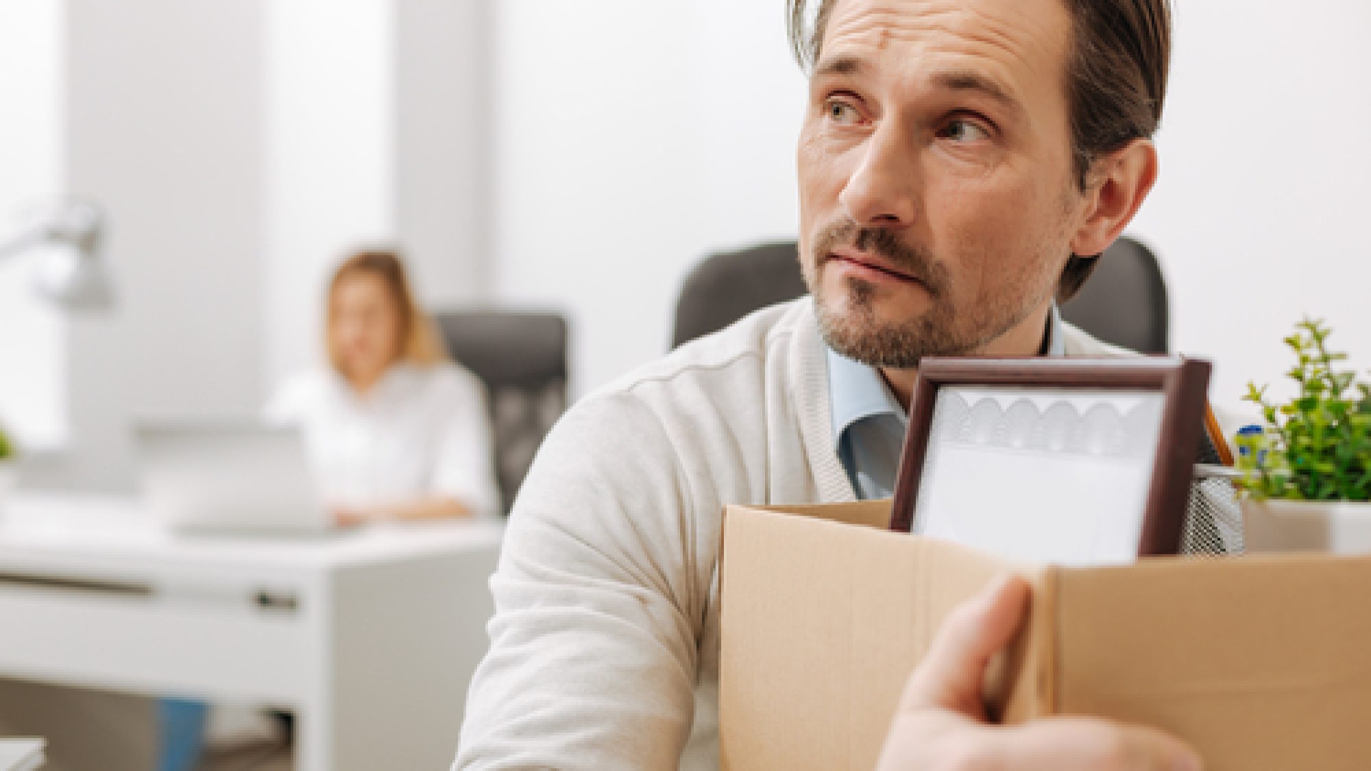 Frightened,Fired,Employee,Holding,The,Box,In,The,Office