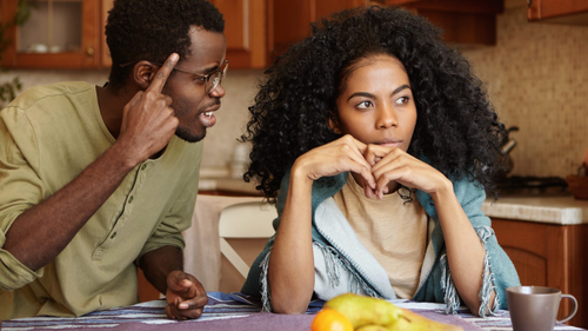 Couple,Having,Dispute.,Annoyed,Beautiful,Dark-skinned,Female,Sitting,At,Kitchen