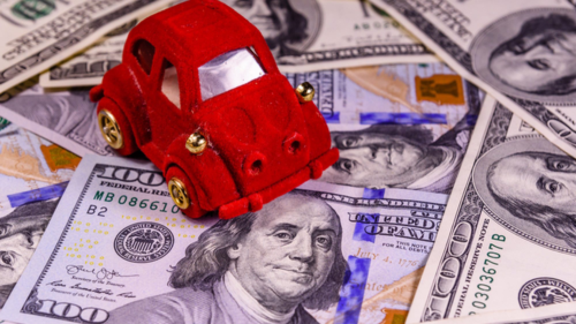 Toy,Car,On,One,Hundred,Dollar,Bills