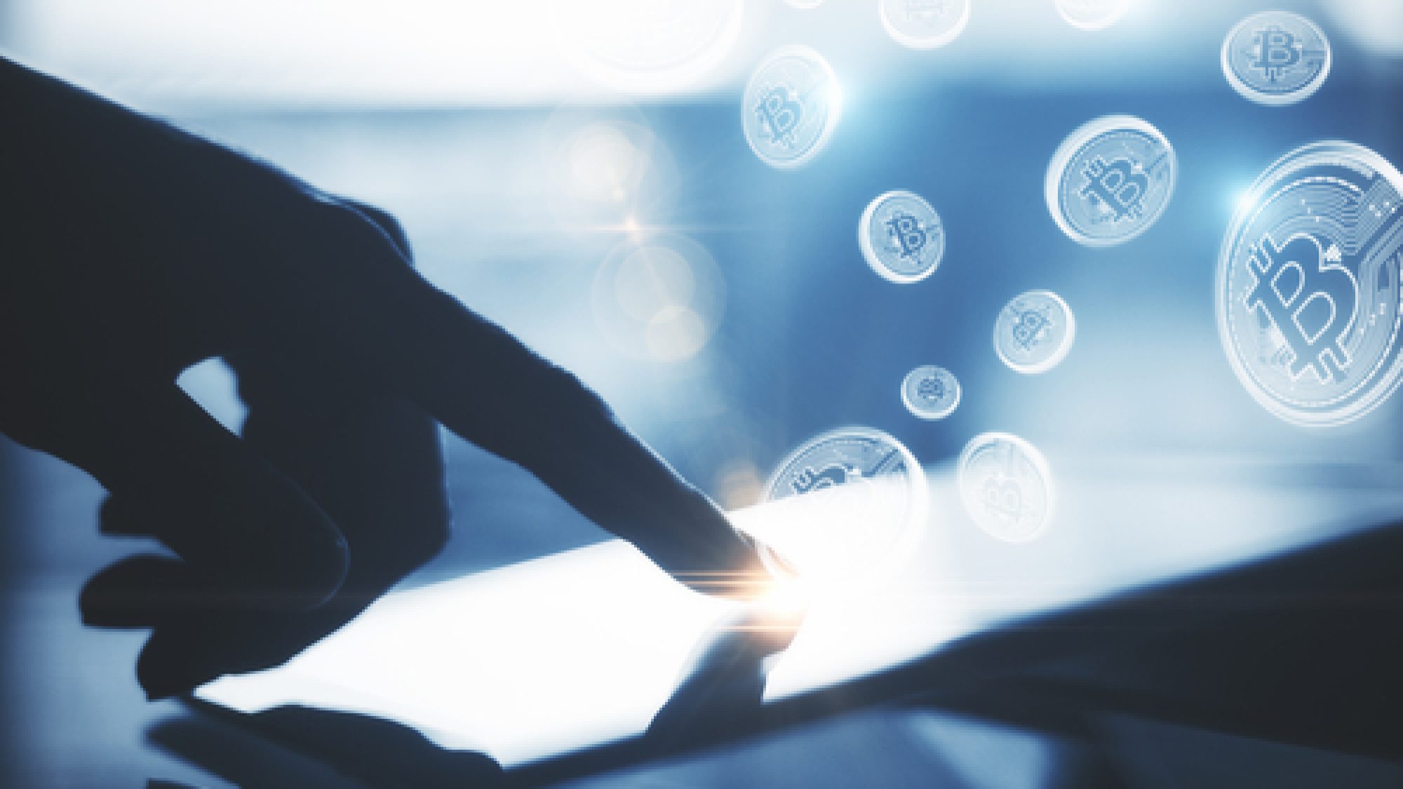 Backlit,Hand,Using,Tablet,With,Bitcoin,Hologram,At,Desk,With
